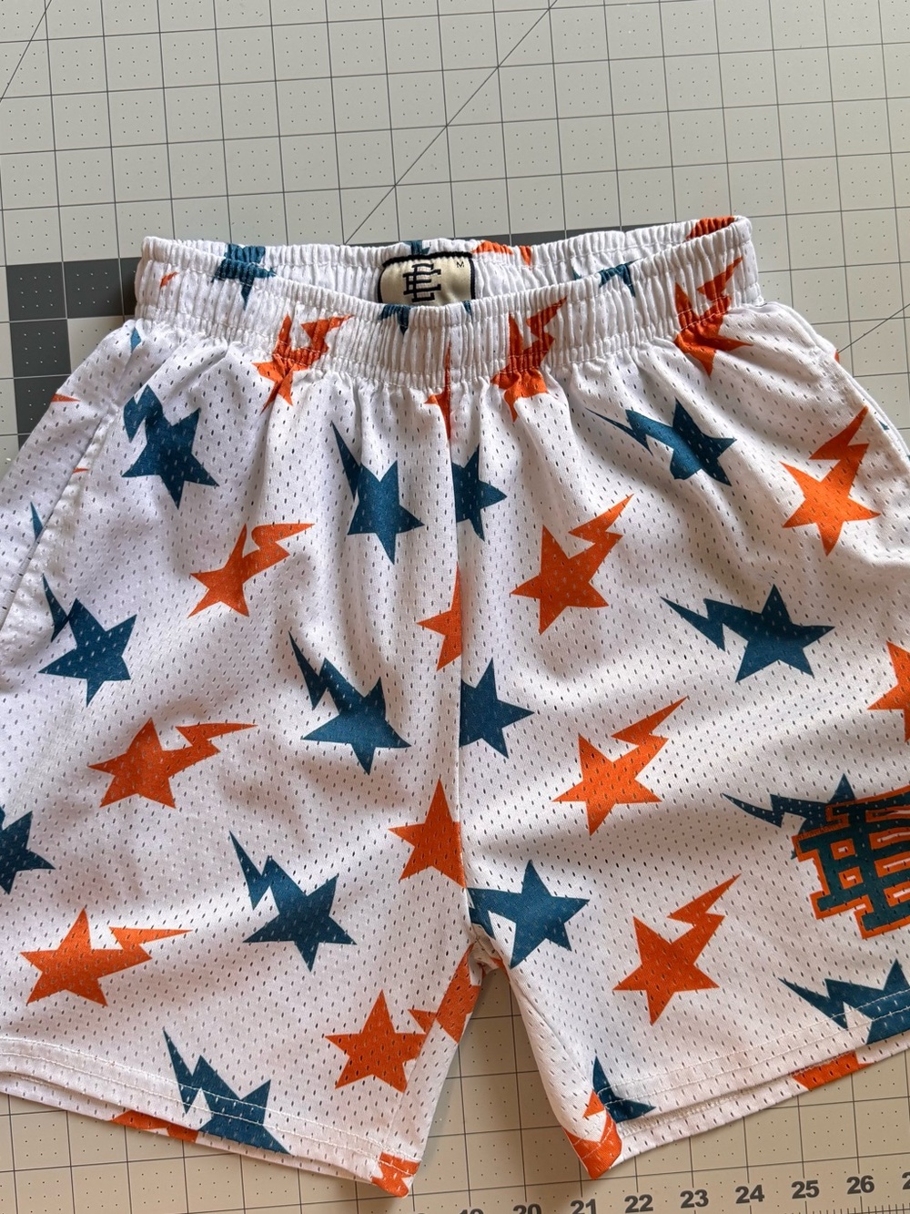 Eric Emanuel Men’s White Athletic Shorts with Orange and Teal Star Print